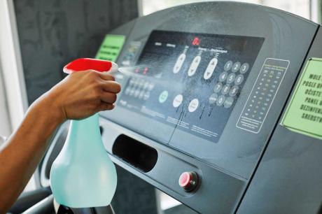fitness machine touchscreen being cleaned 